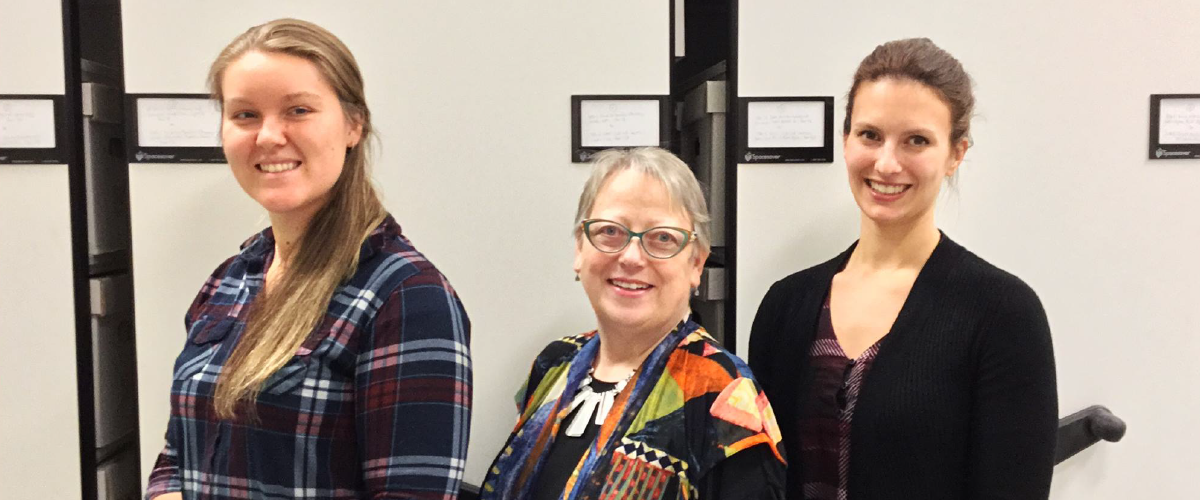 3 women standing. 