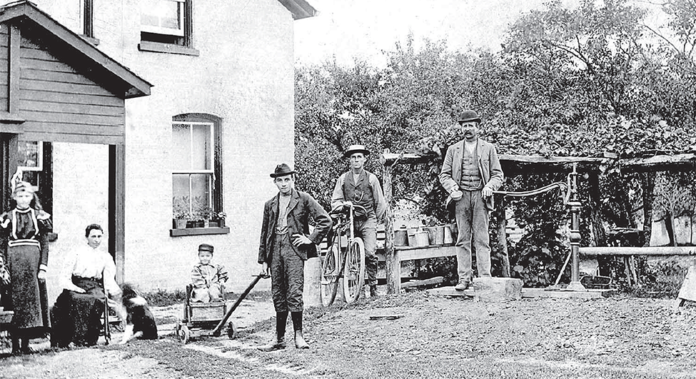 Hawkins family in front of their home.