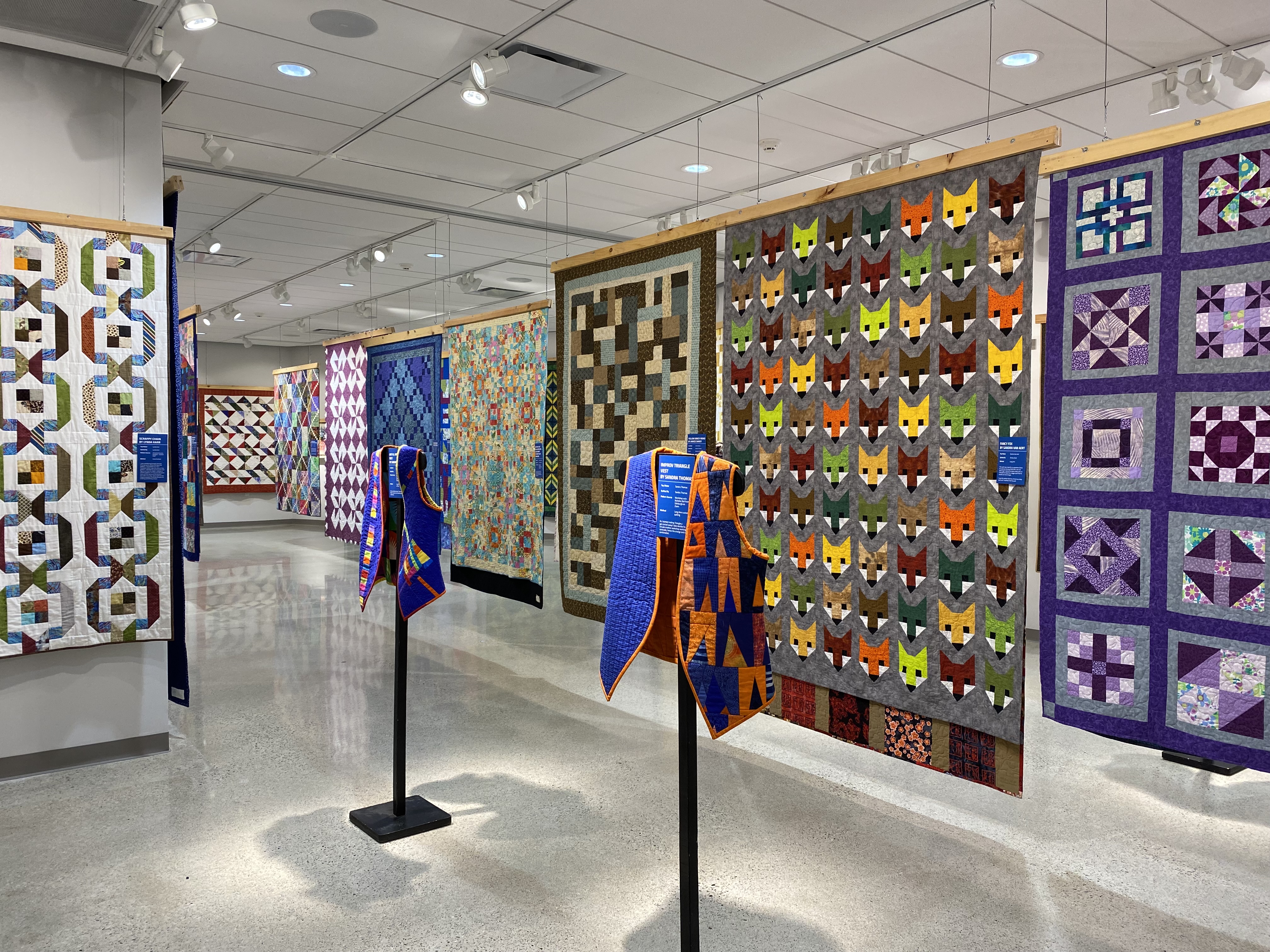 Lambton Heritage Museum displaying hanging quilts at the 2023 Quilt Show.