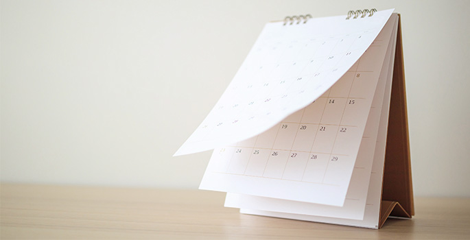 Calendar on a desk with a beige background