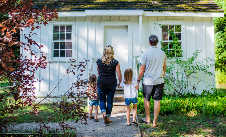 Graphics with doors open logos and family walking toward a door.