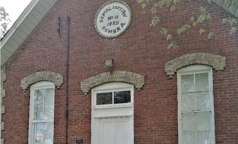 Red brick schoolhouse.