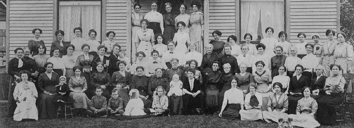 Black and white image of women posing for a photo. 