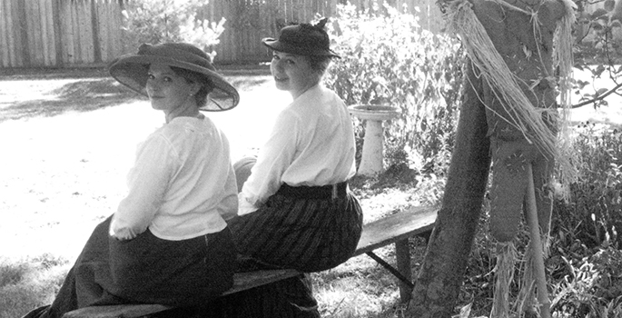 Two ladies sitting.