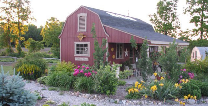 Red barn with garden.